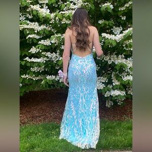 Prom dress blue with sequins giving it other color tones
